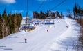 Winter holidays at a ski resort. Ski and ski lift Royalty Free Stock Photo